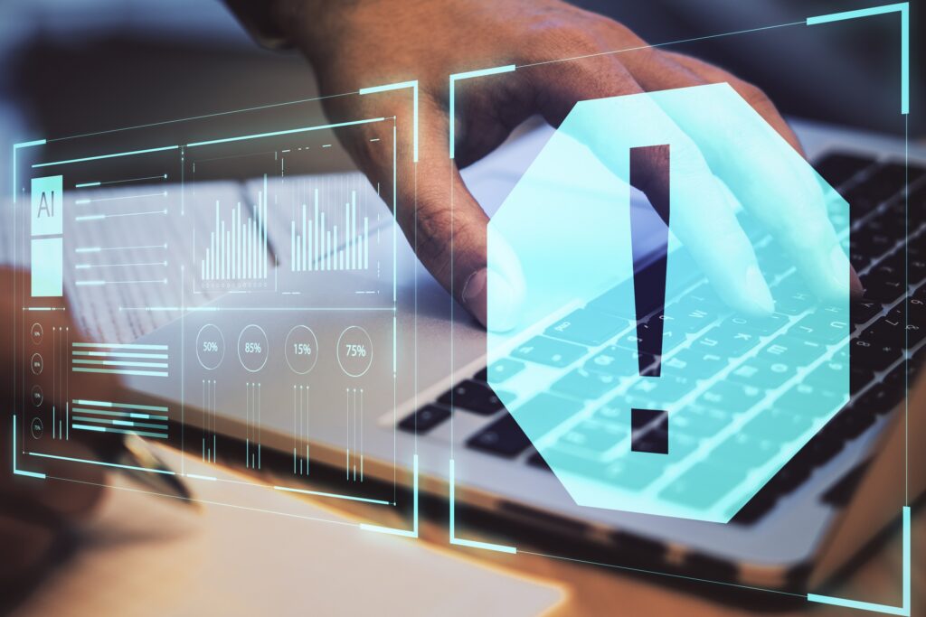 Warning and digital security concept with digital exclamation point at laptop background.